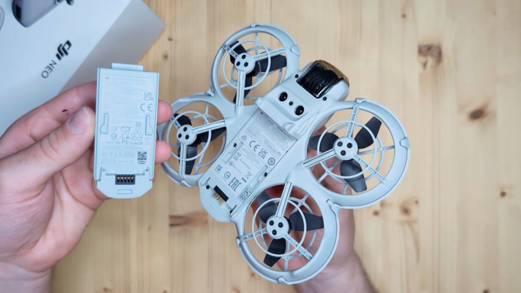 Removing the intelligent flight battery from the DJI Neo